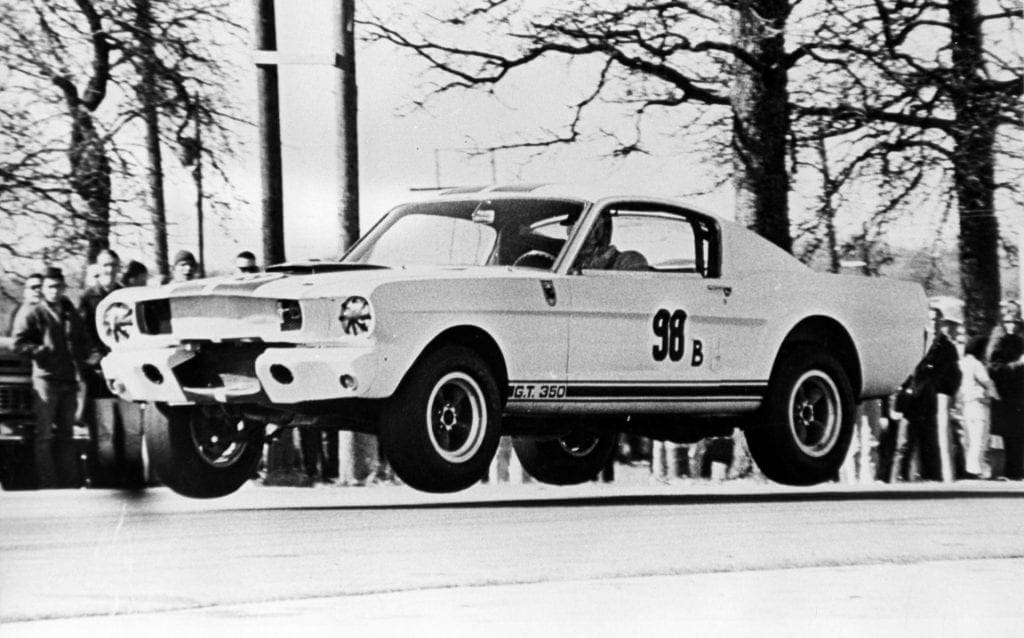 Ken Miles and the 1965 Ford Mustang GT350R go airborne at the Green Valley Raceway in Smithfield, Texas on February 14, 1965.