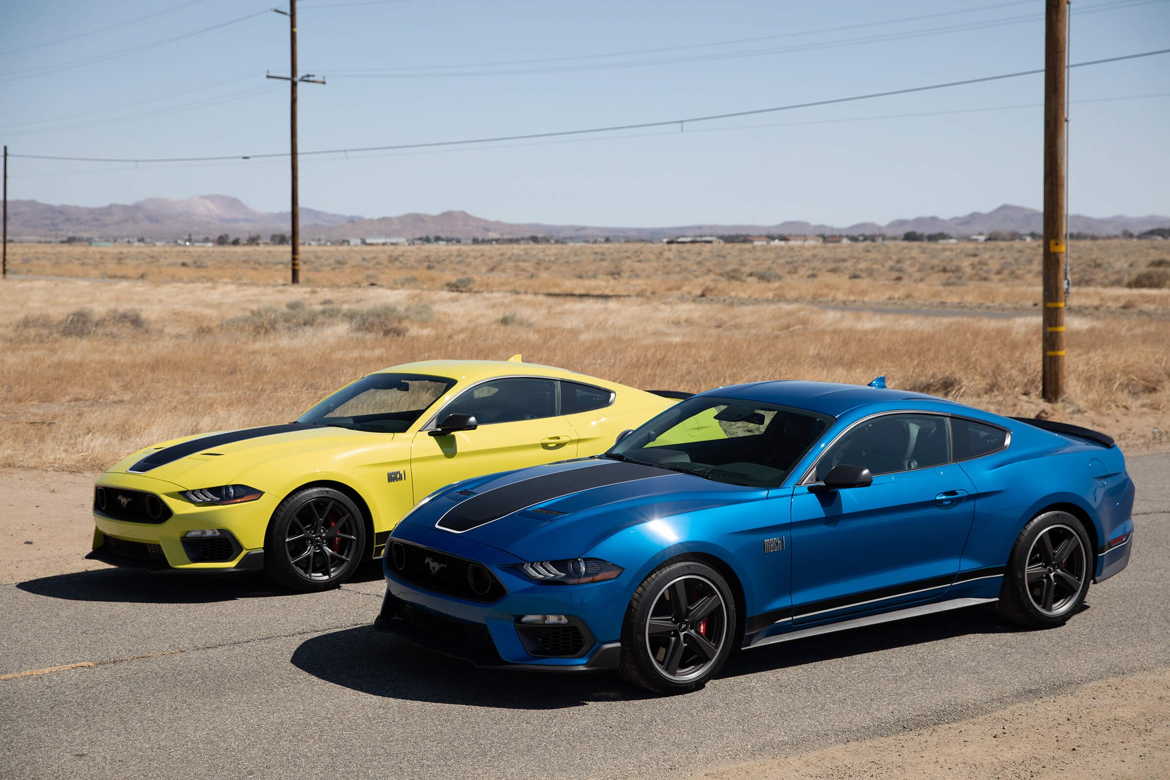 Yellow and Blue 2021 Ford Mustang Mach 1 Parked Side by Side