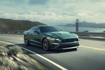 Green 2019 Ford Mustang Bullitt on highway