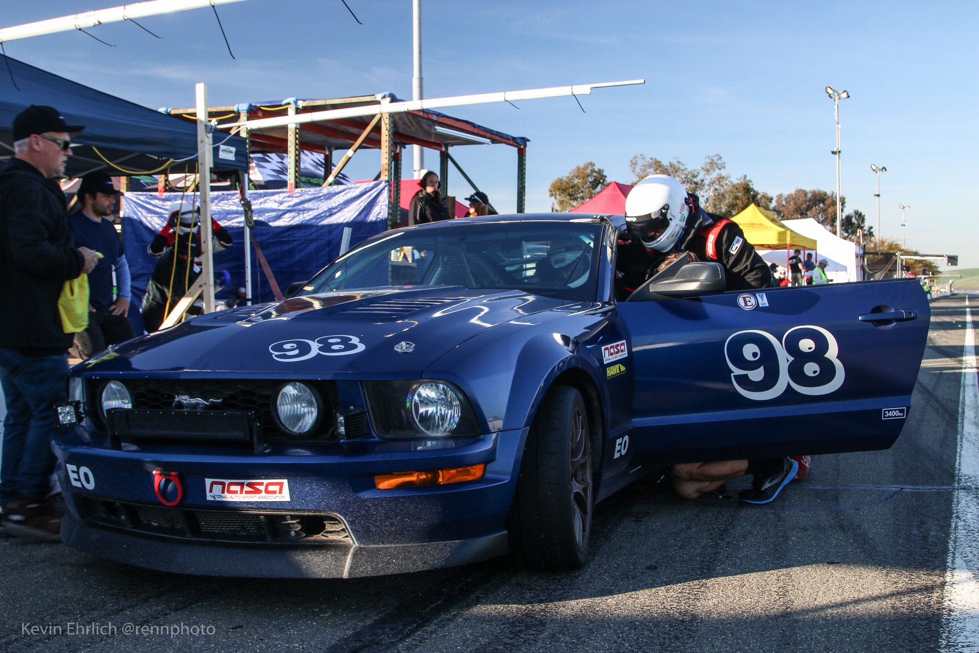 Pit crew working on 2008 Ford Mustang at Thunderhill 2021