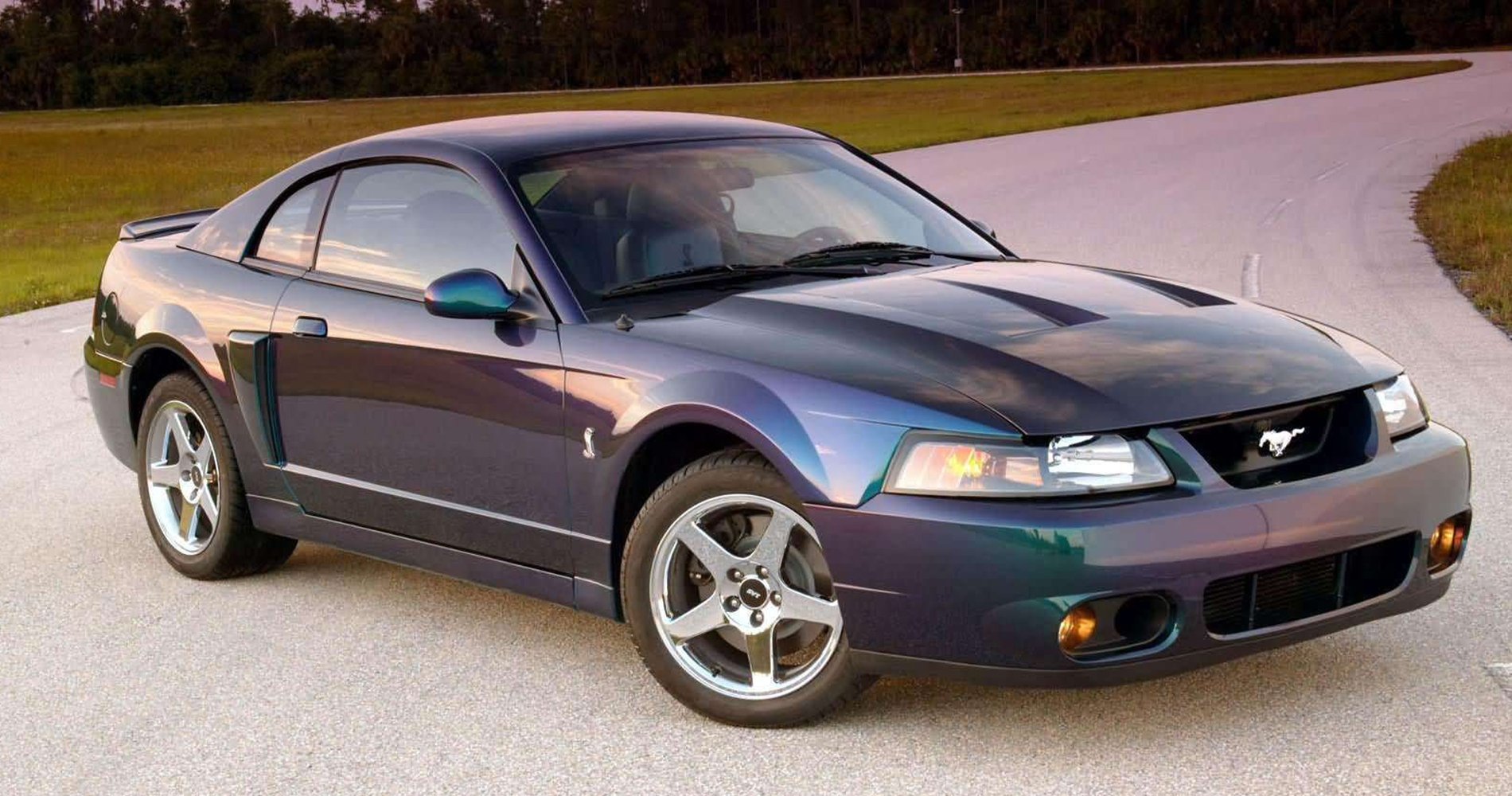 Fourth gen blue Ford Mustang Cobra on a test track