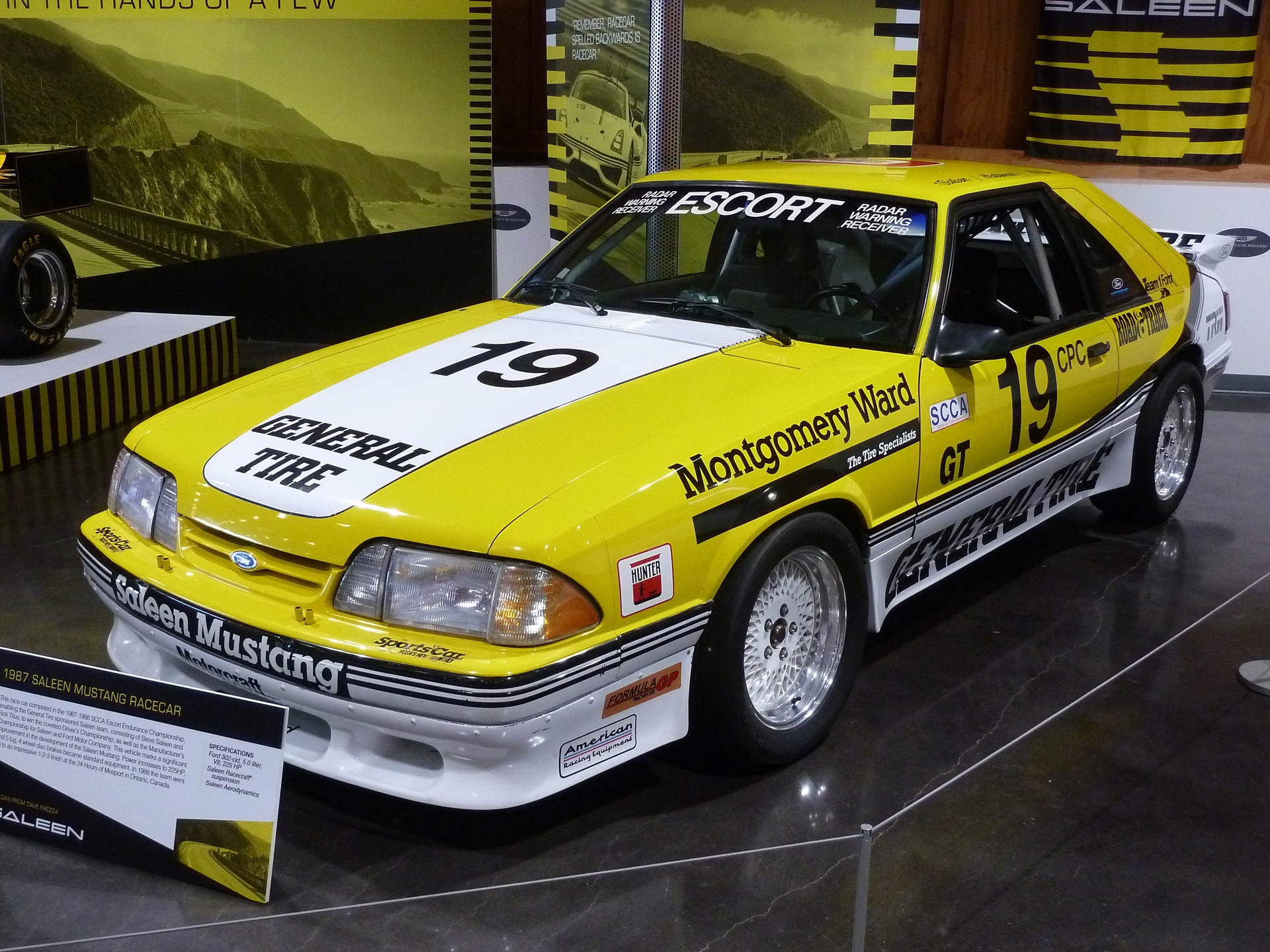 Yellow 1987 Saleen Mustang race car in museum