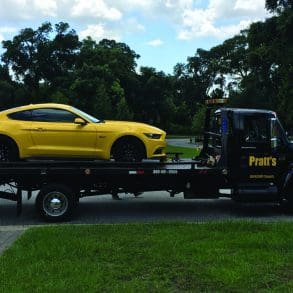 Yellow Mustang on flatbed truck