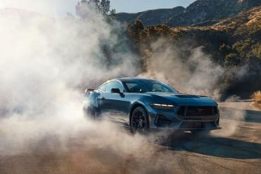 angled view of mustang doing burnout